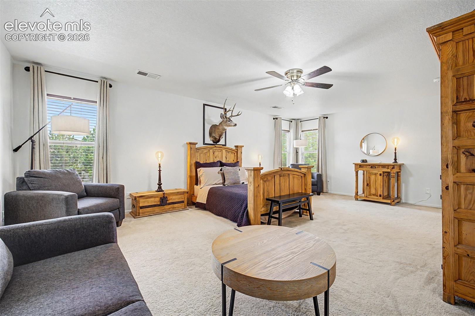 The sheer size of this primary bedroom sets it apart — with room to spread out, multiple windows for natural light, and a layout that adapts to whatever the next owner envisions.
