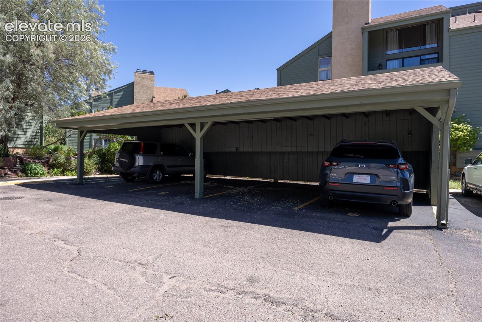 Assigned carport and storage area.