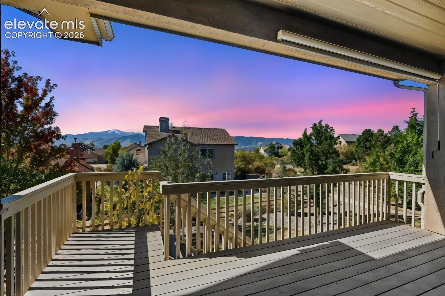 AMAZING VIEWS OF PIKES PEAK AND USAFA AT DUSK FROM THE COVERED DECK
