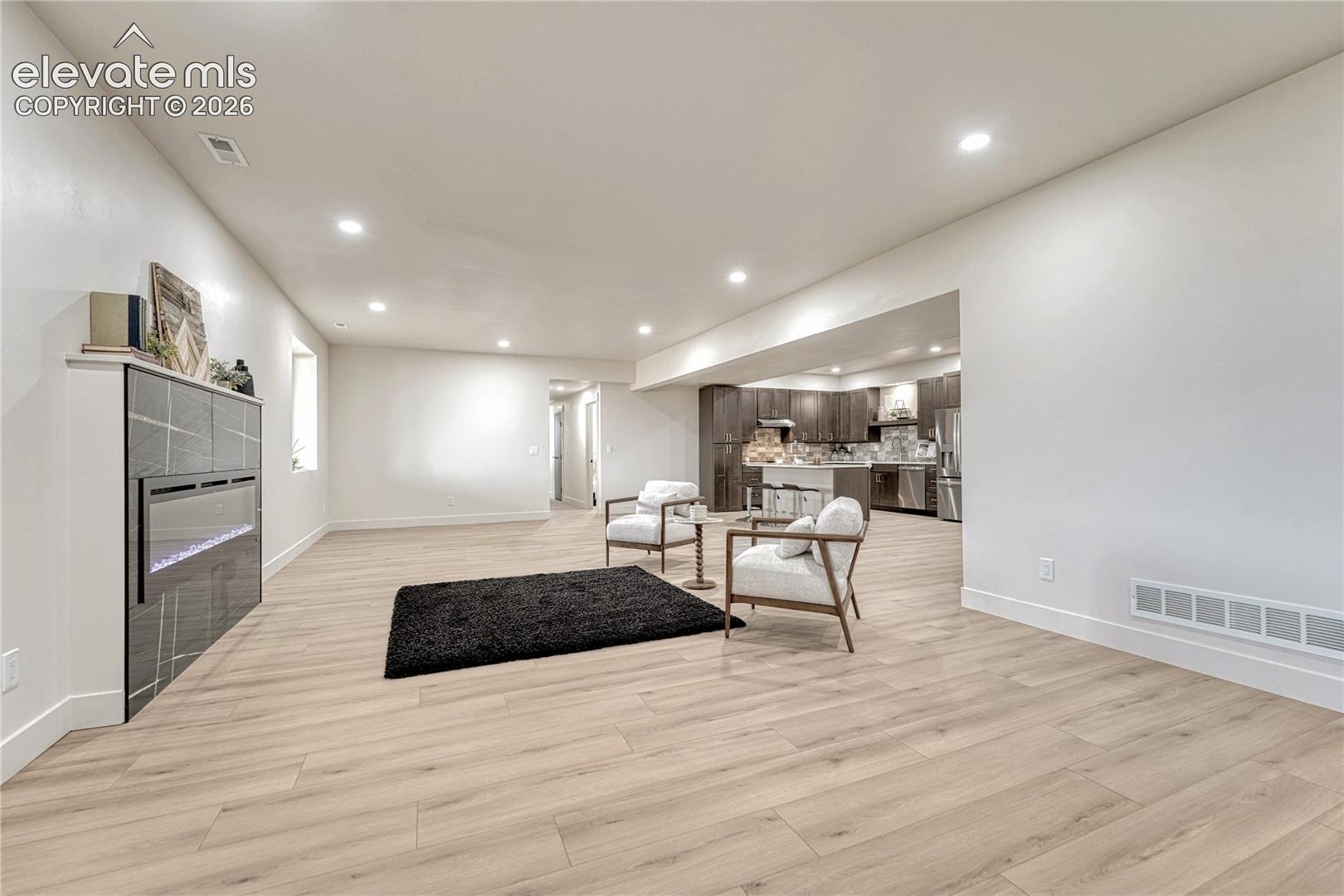 Lower level great room with electric fireplace....