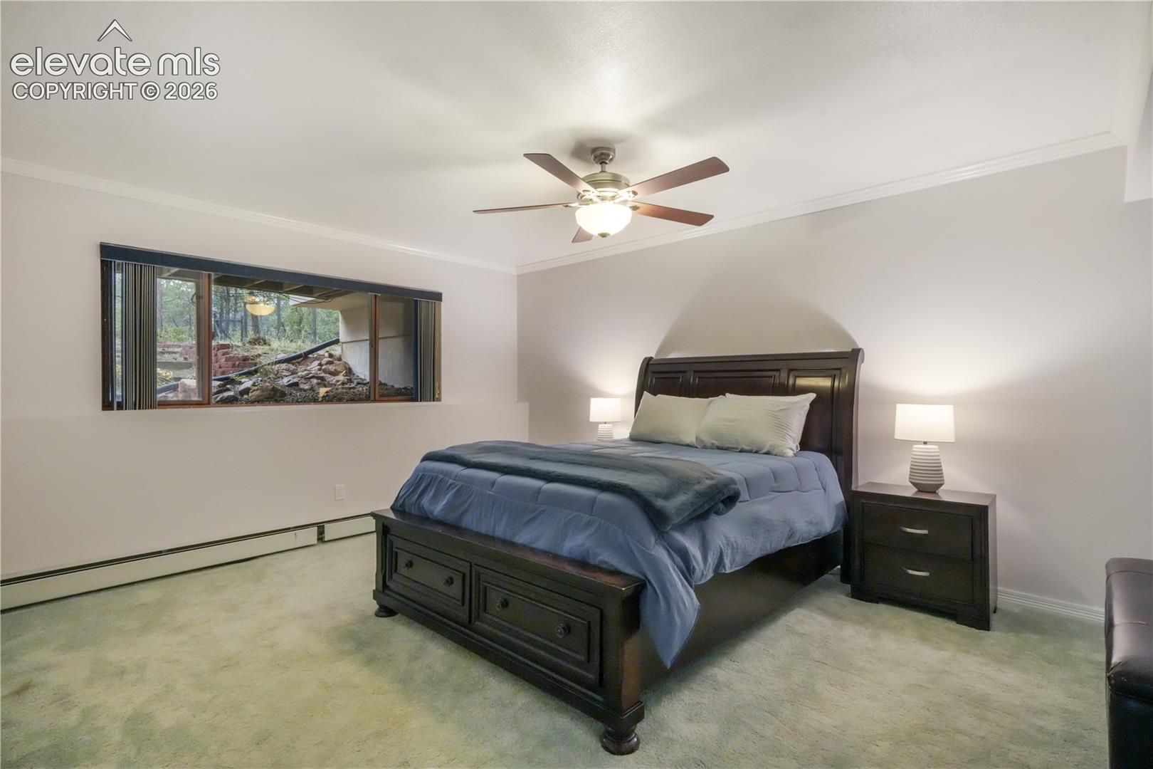Large basement bedroom with dual closets and ceiling fan