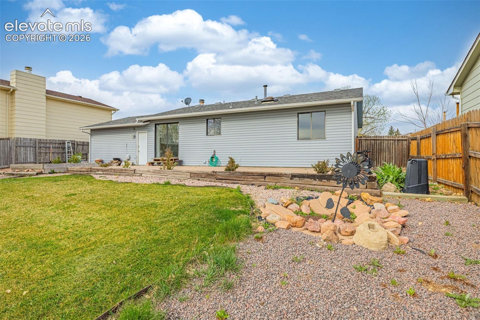 Sliding glass door to back patio; door to garage