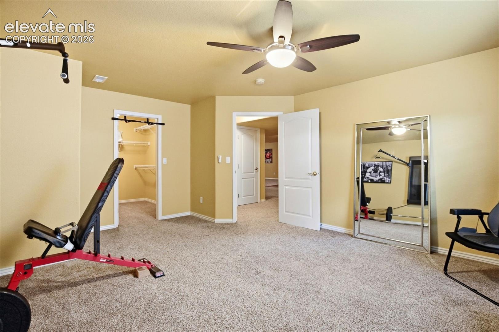 Oversized basement bedroom with walk-in closet.  Shown here as a work-out space but easily tailored to fit your needs.