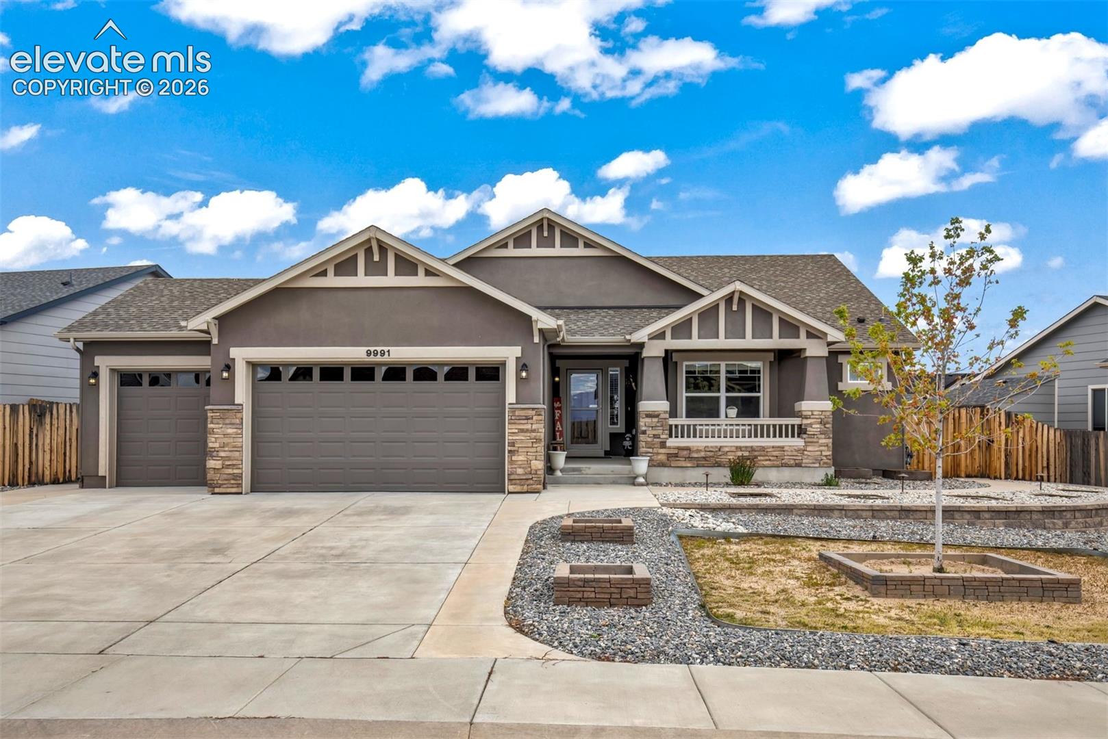 Space, function, and style come together in this 3,907 sq ft Paint Brush Hills ranch—complete with 5 bedrooms, 3.5 baths, a dedicated main-level office, and a 3-car garage.Warm wood floors and rich natural light greet you at the entrance, drawing you into a spacious family room anchored by a stone fireplace, custom wood accent wall, built-in shelving, and custom interior wood beams that add detailed character throughout the home. The open kitchen is ready for entertaining—featuring modern cabinetry, granite countertops, a tiled backsplash, stainless appliances, and a center island made for easy everyday meals.  The primary suite serves as your main-level escape, featuring a private bath with a double vanity, oversized walk-in separate shower, and deep soaking tub. Just off the main living area, the interior garage is completed with custom trim and paint, along with a dedicated 220V outlet setup for your tools and personal projects.Downstairs, the finished basement opens up endless options for movie nights, a game room, or a gym, complete with a dedicated custom wet bar and sink setup for easy hosting.Step outside to an expansive backyard designed for easy outdoor living, featuring custom landscaping, smooth concrete walkways, a spacious patio, a pergola, raised garden beds, decorative rockwork, and a custom shed for extra storage. Tucked into a great neighborhood surrounded by parks, walking trails, and Antler Creek Golf Course, you're just minutes from local schools, shopping, dining, and nearby military bases—all with no mandatory HOA to tie you down.