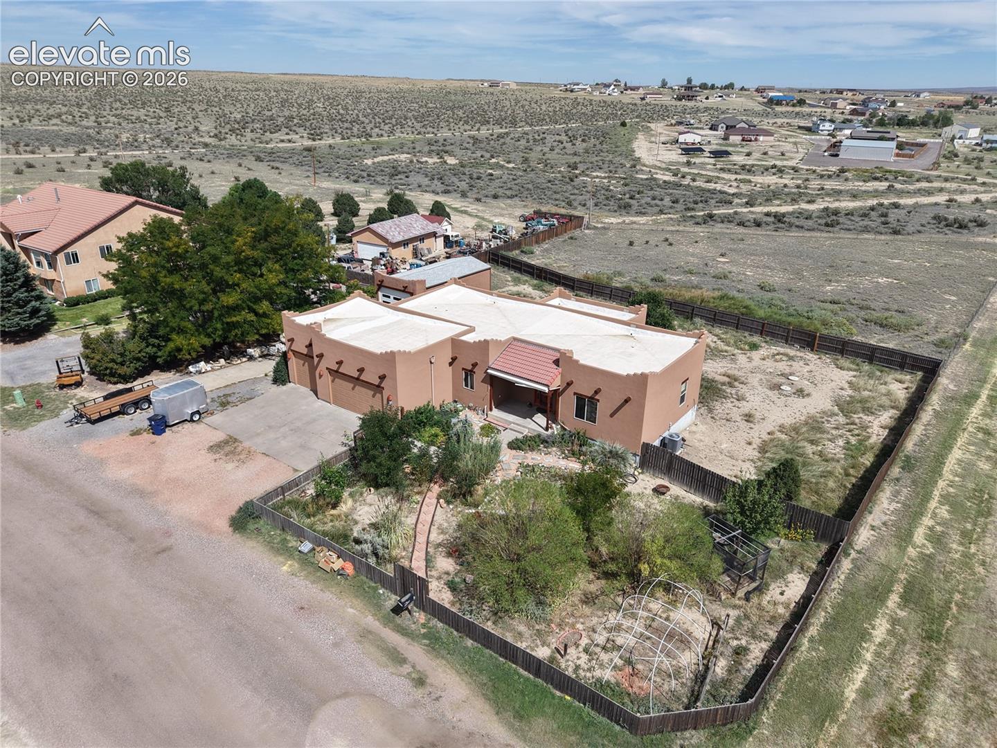 Full view of the home and land.