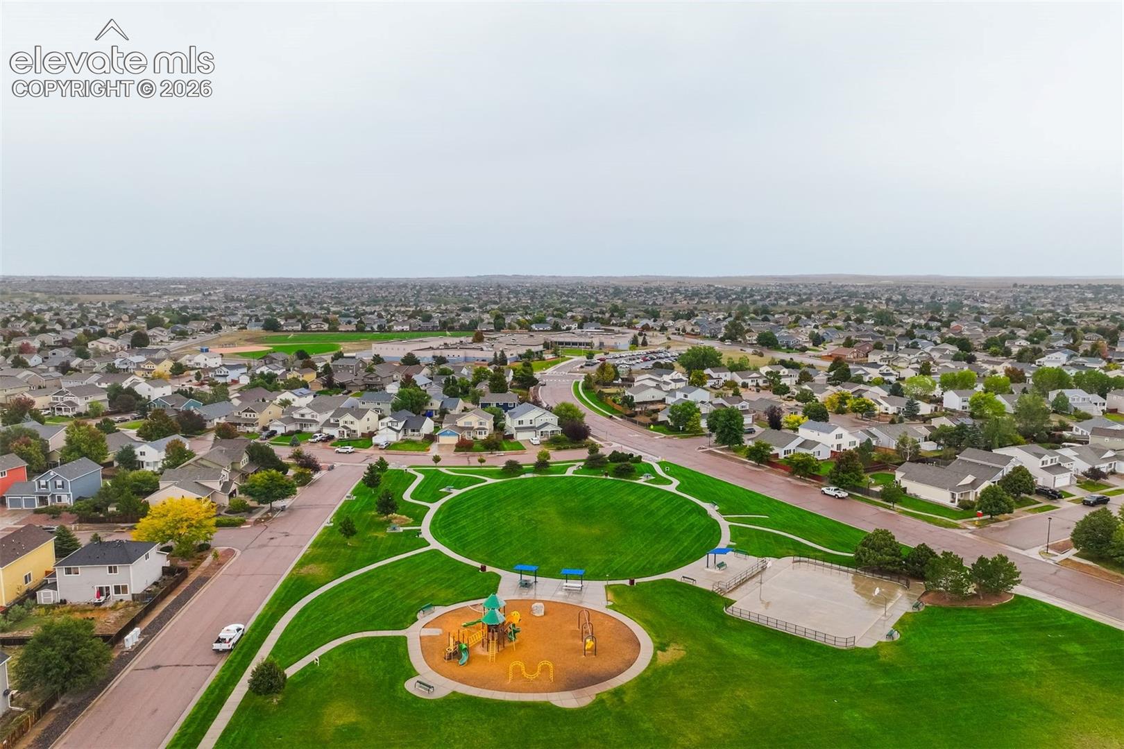 Expansive neighborhood featuring numerous residential properties and a central green space