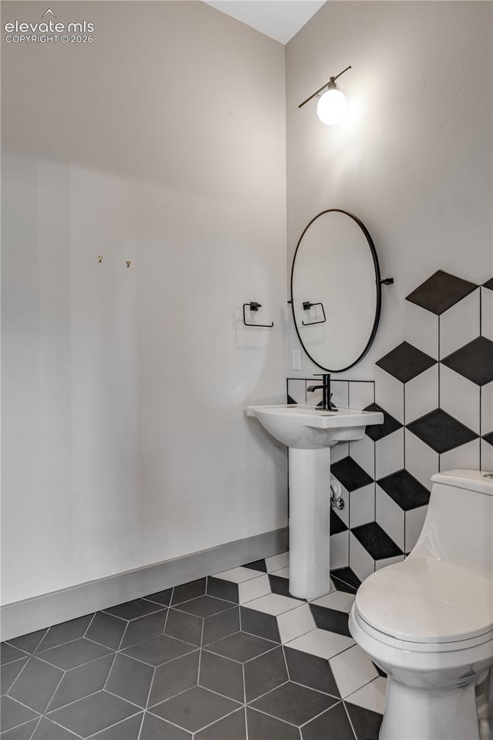 Half Bathroom with Tile Flooring 