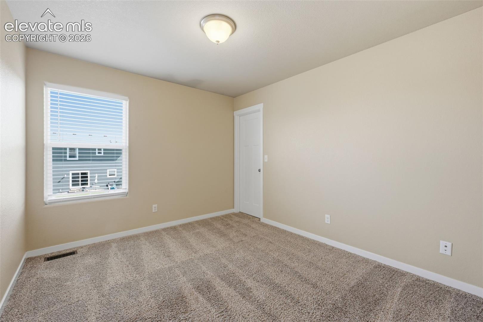 Neutral finishes make this upper-level bedroom easy to personalize for sleeping, study or work-from-home use.
