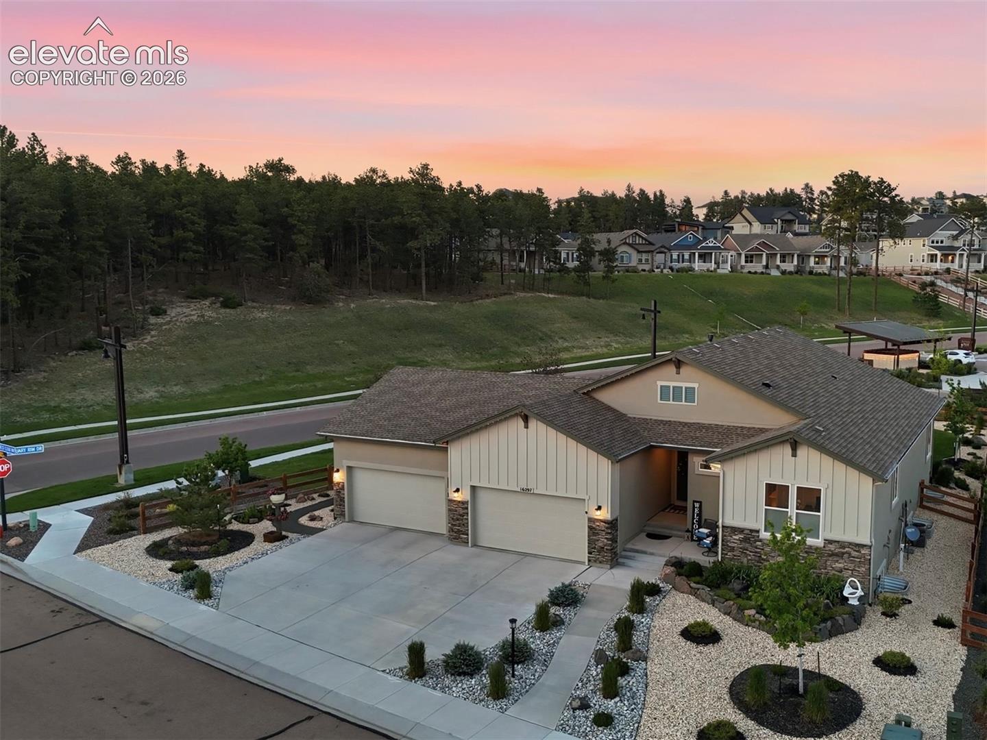 WHERE PRIVACY MEETS NATURE — Tucked into a quiet corner lot with tranquil forest views beyond, this exceptional setting offers the peaceful Colorado lifestyle you’ve been dreaming of.