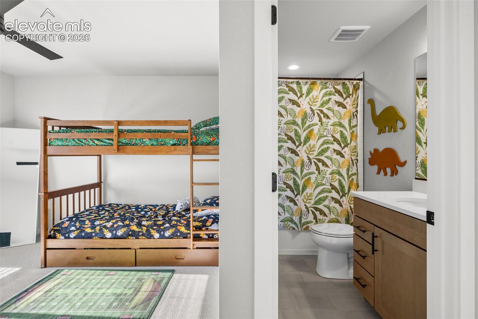 The front-facing upstairs bedroom is bright and spacious and has a private, adjacent bathroom. 