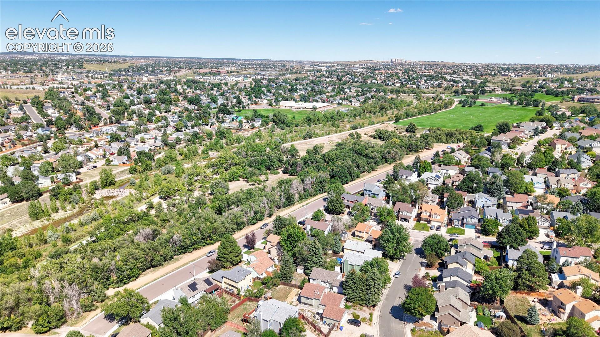 Aerial View of home with Cottonwood Creek Park and Trail across the street