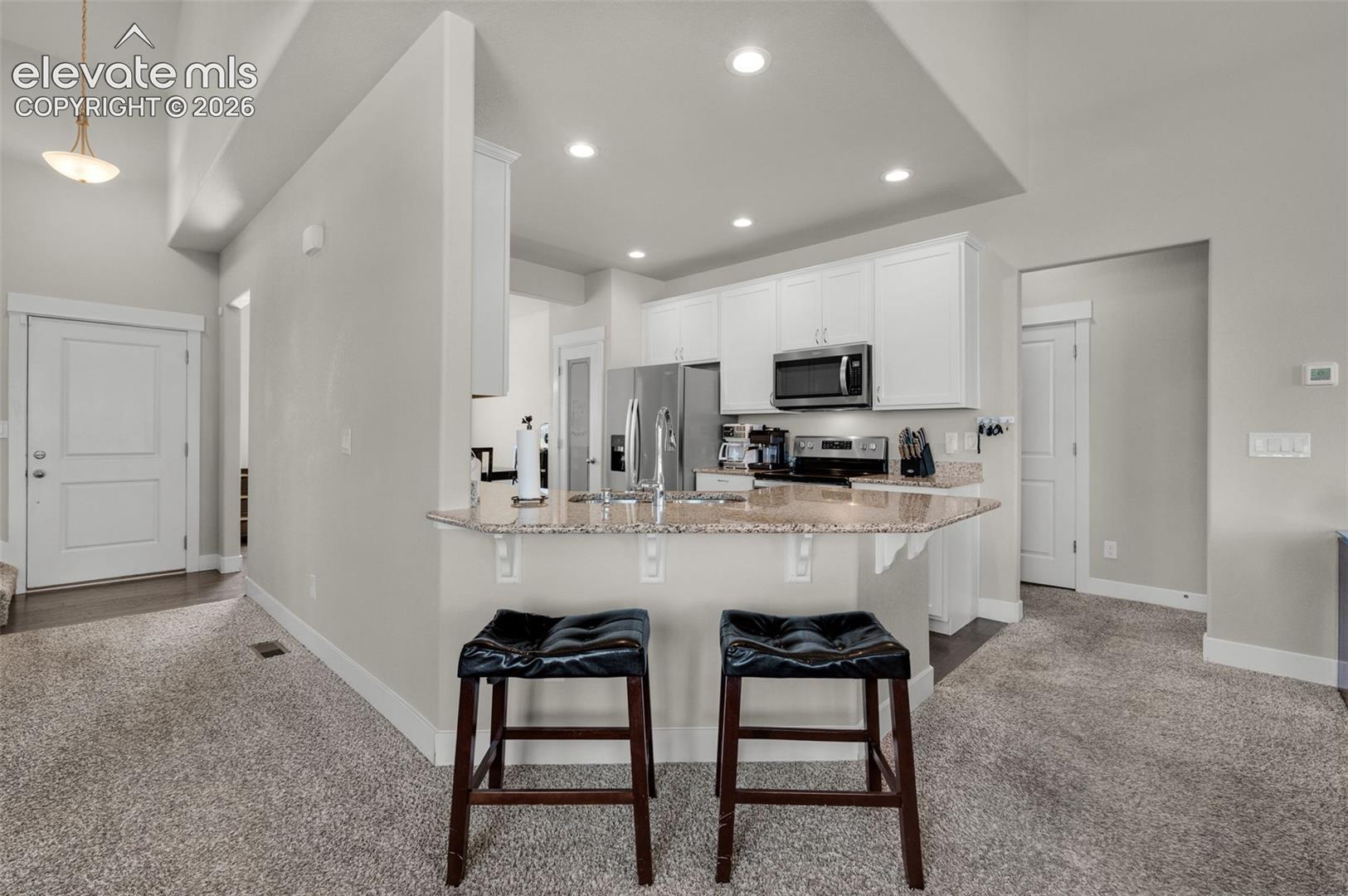 Counter bar extends into back of  living room