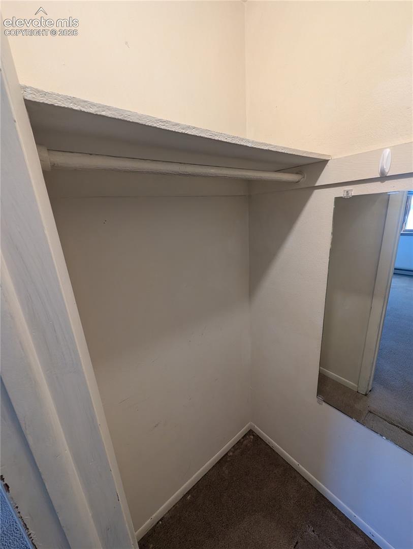 Built-in closet with integrated shelving and hanging rod