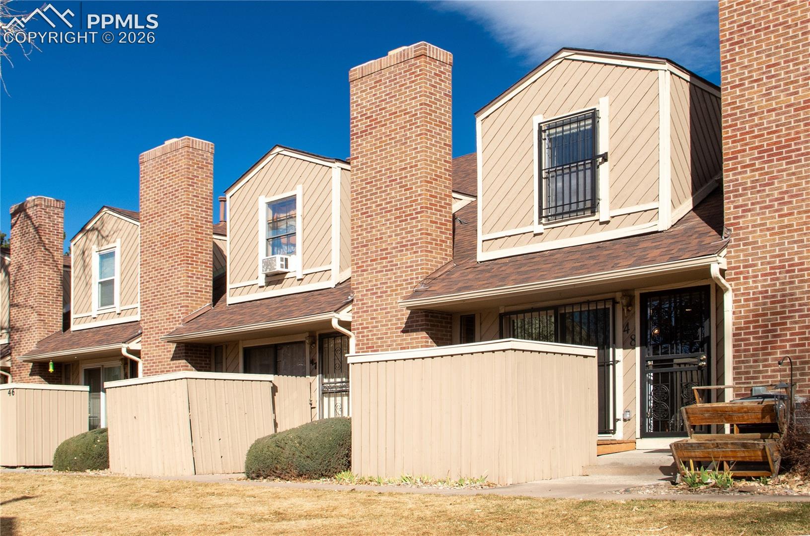 Move-in ready 3-bedroom, 2-bath row home-townhouse in the heart of Denver with an attached 2-car garage that is big on convenience! You will walk into an open layout featuring a cozy family room with a vaulted ceiling and a fireplace, a dining area that opens to a private patio—perfect for relaxing —and a modernized kitchen with granite counters, plenty of cabinet space, and a breakfast bar. The garage entry is on the main level, right off the kitchen, for convenient access. The upper level has all 3 bedrooms, ample closet space, and 2 tastefully remodeled baths. The basement offers extra space for unwinding or hosting gatherings, featuring a family room and a wet bar. Behind the sliding barn door, you will discover a cleverly designed storage space. New furnace, AC and fireplace insert. The community has additional parking for guests, a playground, a community dog park, and BBQ areas with picnic tables. This centrally located home offers a convenient and hassle-free lifestyle, perfect for those seeking low-maintenance living.