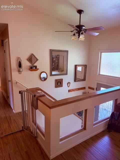 Decorative glass inserts un the upper-level partition wall add architectural interest and enhance ambiance
