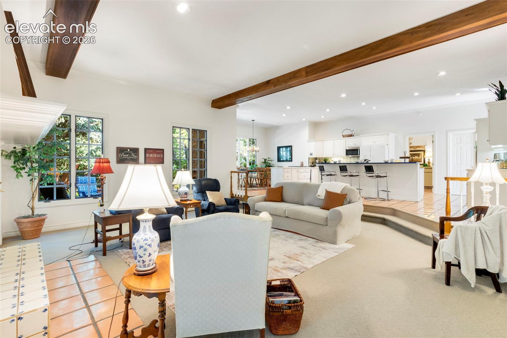 Stepdown family room open to the kitchen and casual dining area with walkouts