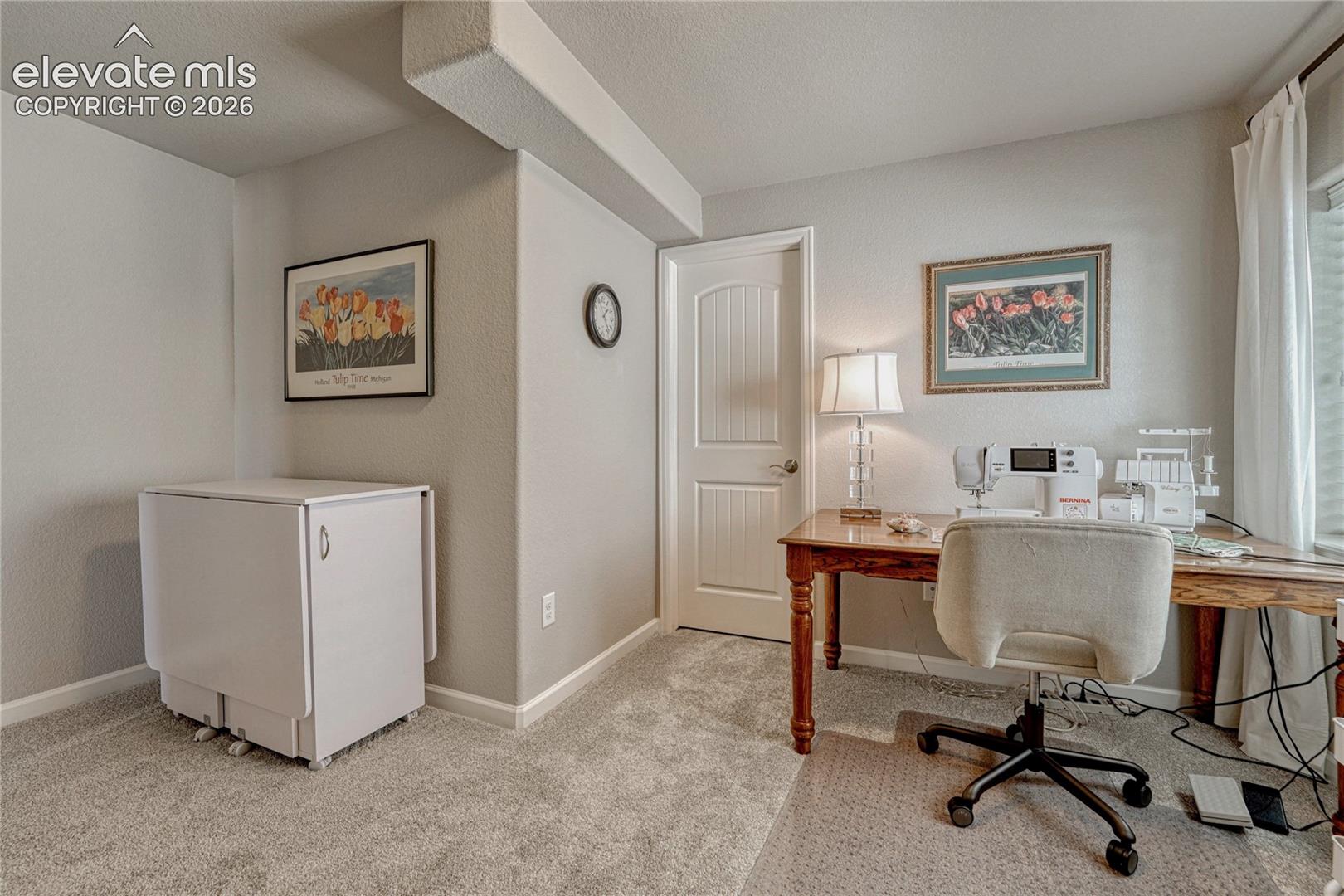 This adaptable basement room works beautifully as a guest suite, studio, or home office with additional storage available in the adjoining walk-in closet.
