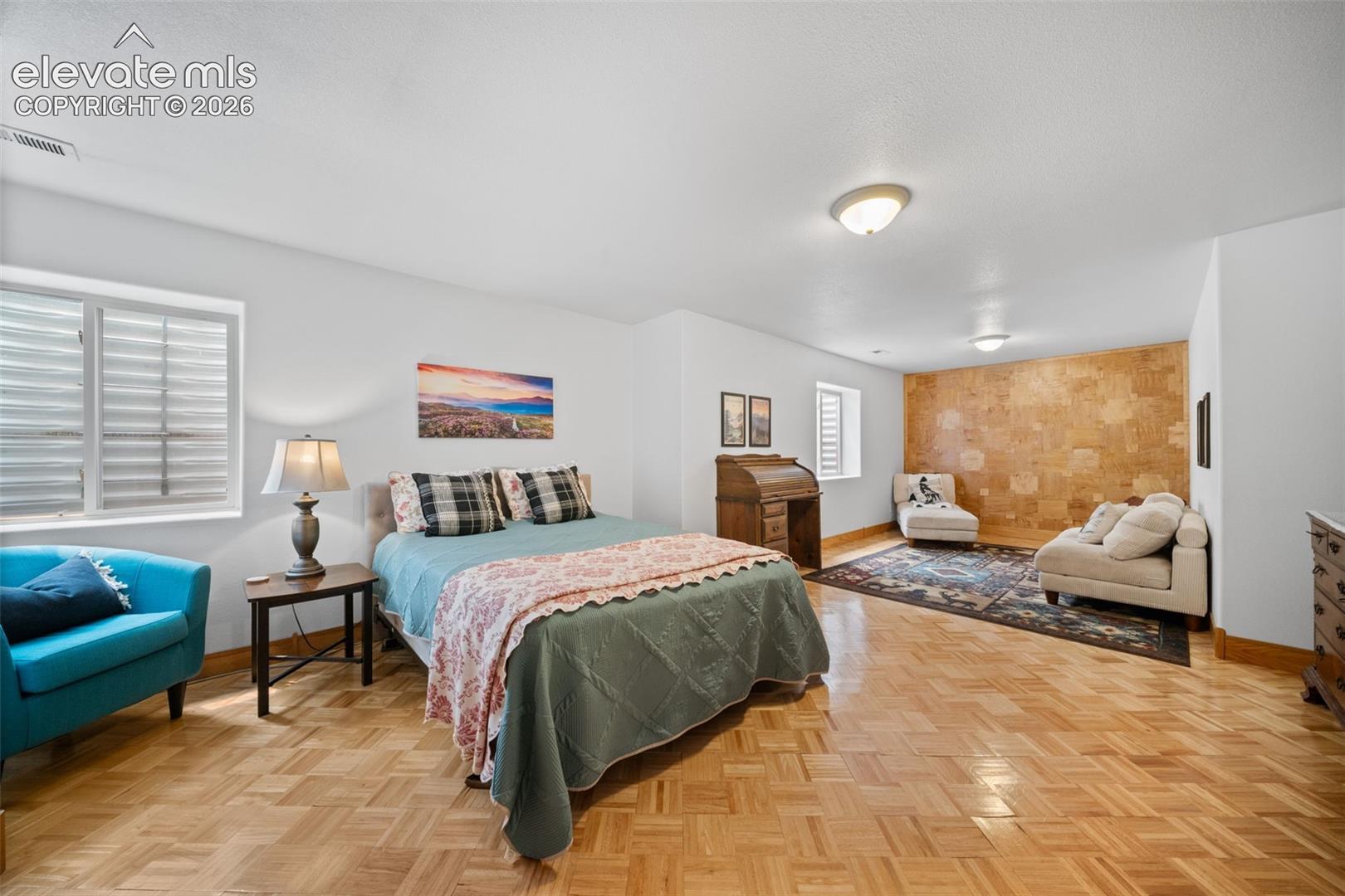 Basement bedroom with sitting area that could be used for extra sleeping space, craft area or creative art space