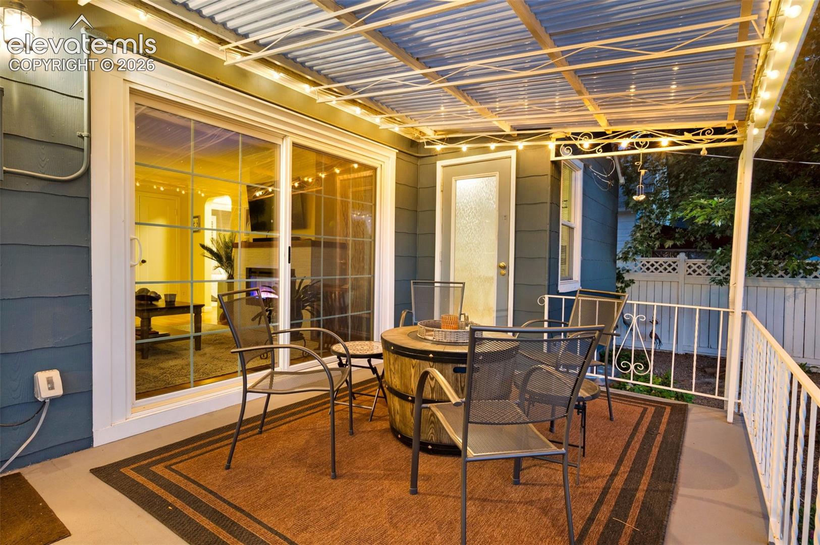 back covered patio with walkout from living room