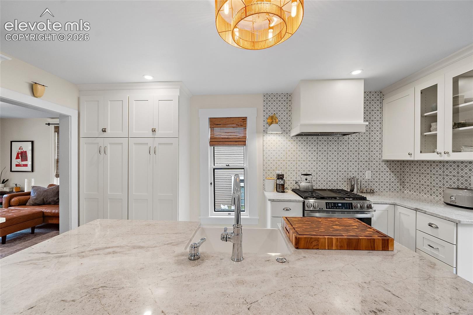 Plenty of storage, hidden microwave, custom hood that vents to exterior