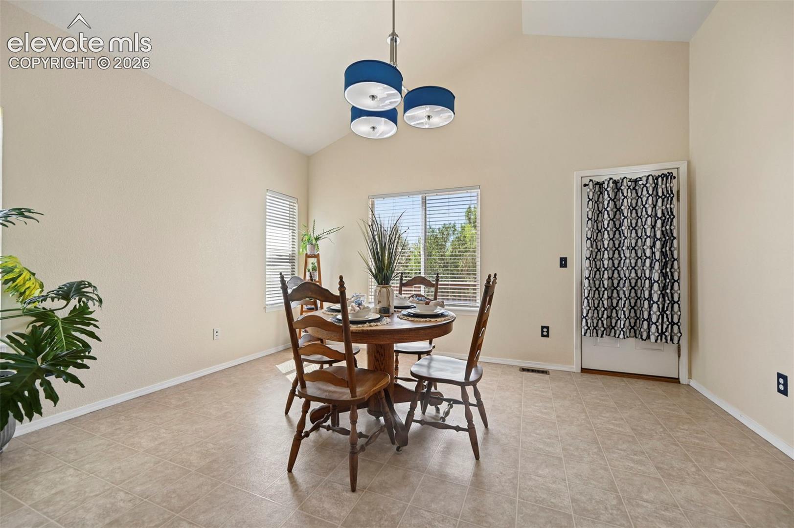 Large dining room with walkout to beautiful wood deck.