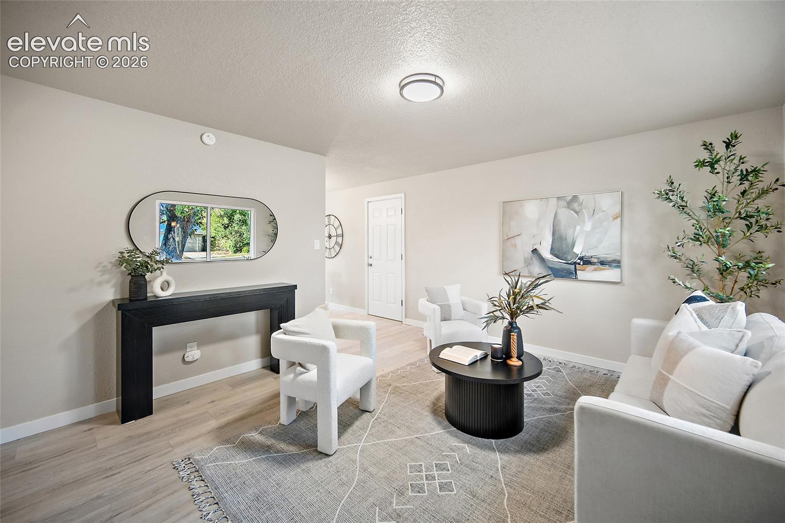 Light-toned walls complement wood-finish flooring