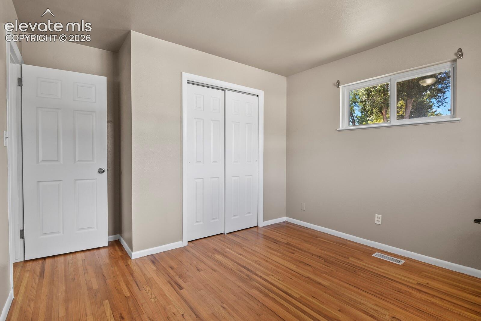 2nd bedroom with hardwood floor