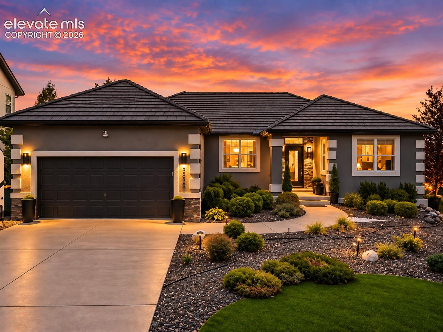 CURATED DESIGN. EXTRAORDINARY DETAILS. COLORADO LIVING WITH A POINT OF VIEW. | Owned and meticulously curated by an accomplished interior designer, this is not a home assembled from a checklist—it is a collection of spaces, finishes and details selected to create something truly distinctive. | The main level offers sophisticated living and entertaining spaces, including a dramatic fireplace lounge, designer lighting and radiant-heated floors in the entry, kitchen and baths. The showpiece kitchen blends exquisite design with culinary function—a waterfall quartz island, 36-inch Bertazzoni Gas Range & Vent Hood with pot filler, and an impressive full-size, dual-zone Sub-Zero wine refrigerator. A complete list of high-end appliances is provided. Thoughtfully selected finishes create a kitchen designed as beautifully for entertaining as for cooking. | The primary suite continues the experience with a beautifully appointed bedroom and striking spa-inspired bath. Layered textures, lighting and carefully composed finishes create rooms that feel individual yet beautifully connected. | Outdoor living is equally compelling. Multiple decks capture the mountain setting with an exterior fireplace, hot tub and inviting spaces for dining and entertaining. Below, the triple-terraced backyard retreat features low-maintenance artificial turf and a firepit conversation area, while the walkout lower level extends living outdoors. | The lower level offers multigenerational flexibility with living and dining spaces, bedrooms, bath and an informal secondary food-preparation/kitchen area. A private entrance from the laundry room creates separation between levels; the laundry is the shared transition space, with direct garage access serving both living areas. | Ideally positioned in north Colorado Springs with exceptional access to shopping, dining, recreation and major corridors. | A home designed to be experienced—not simply viewed.