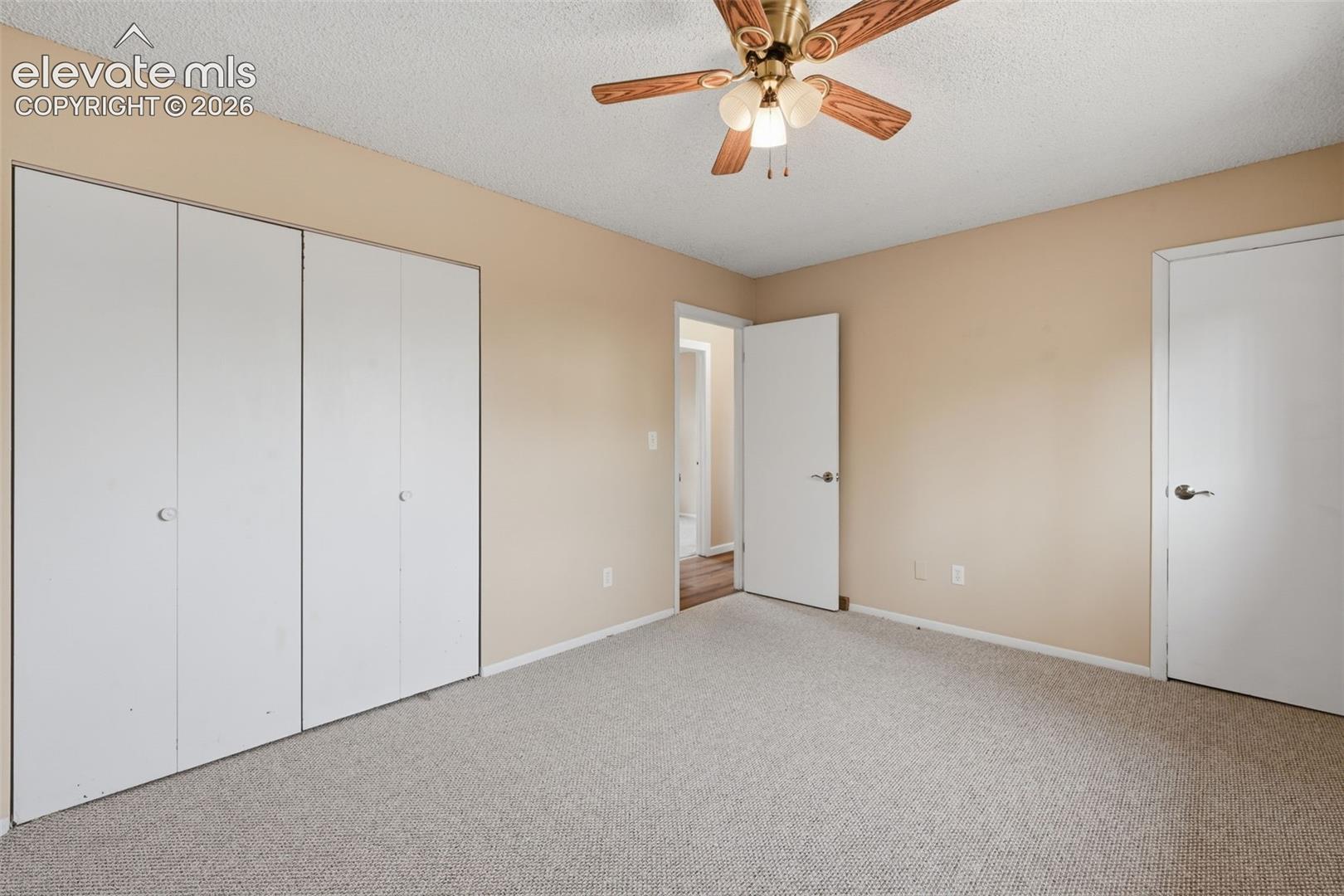 Textured carpeting with light-toned walls