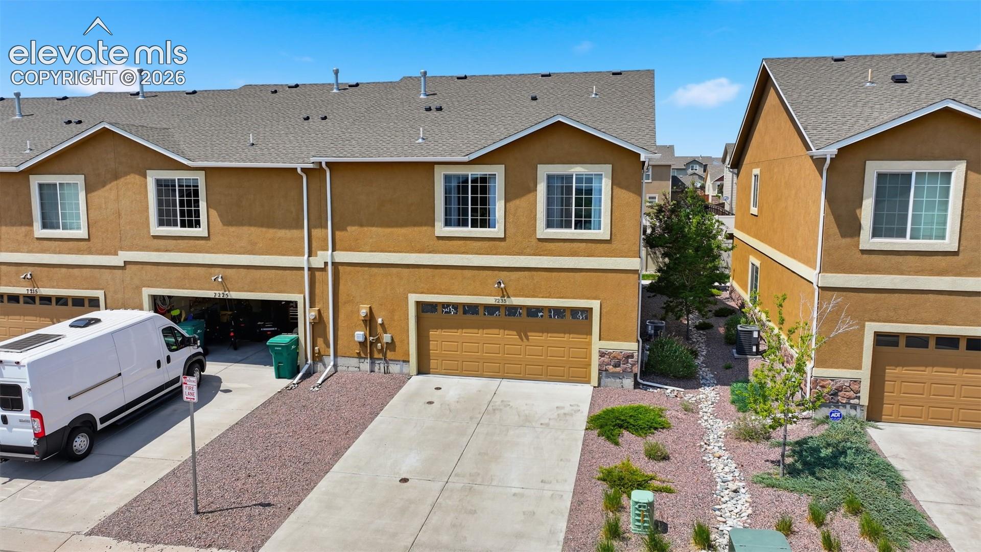 Back view with spacious two car garage