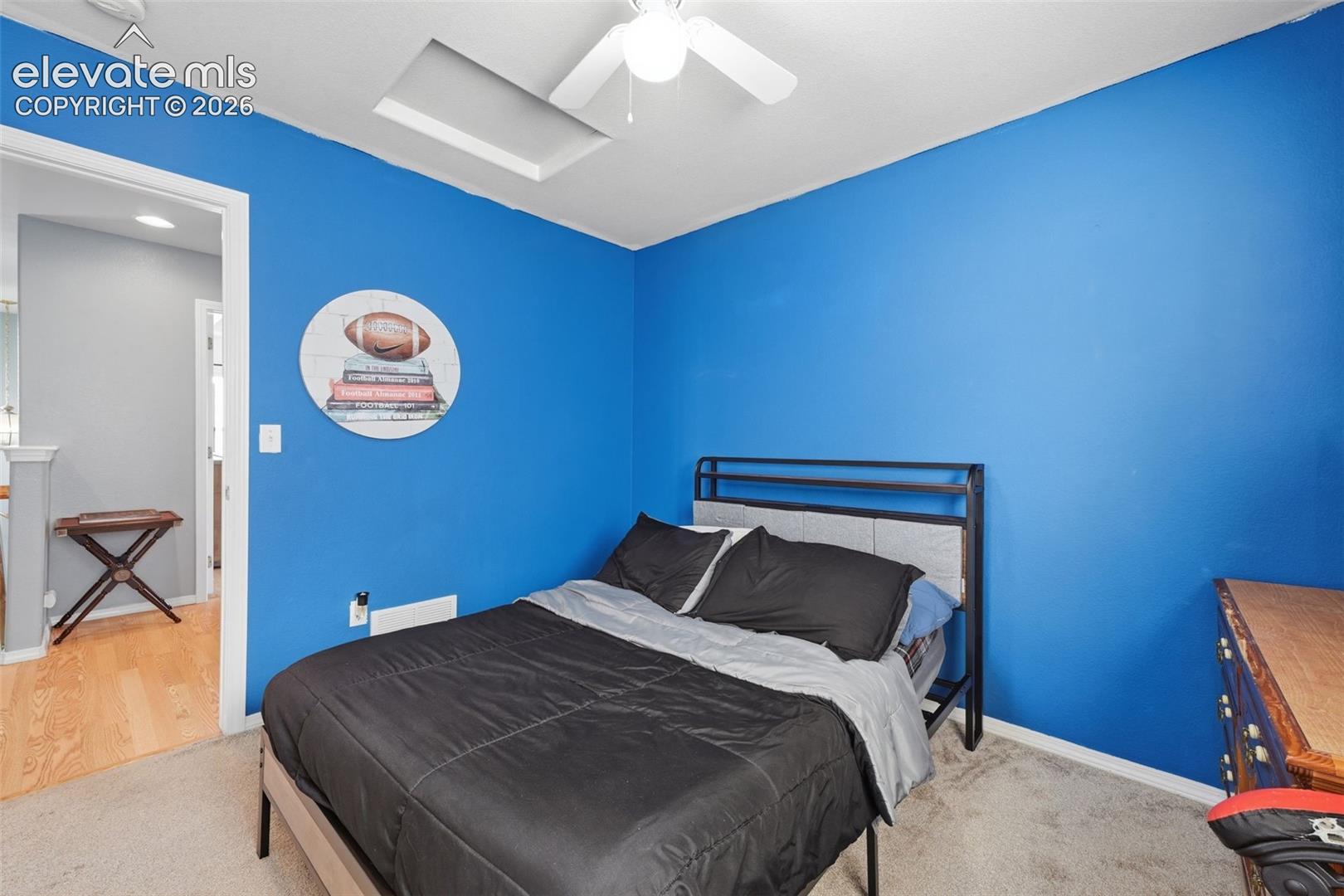 Recessed ceiling light, ceiling fan with light, and carpeted flooring