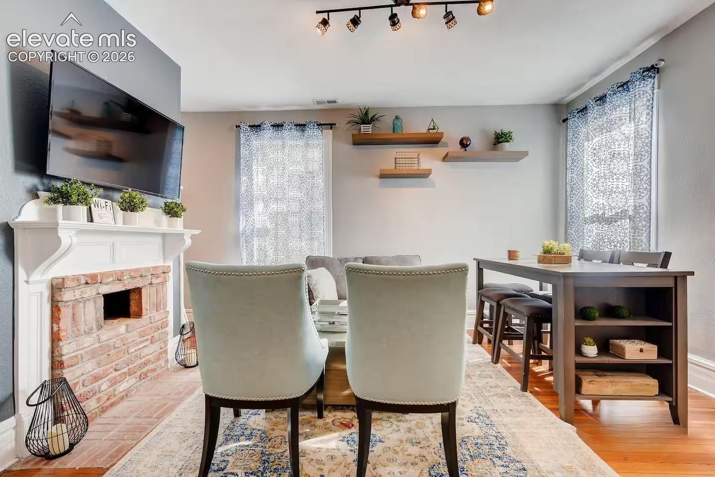 Fireplace may not be functional currently, but still brings style and charm to this living space.