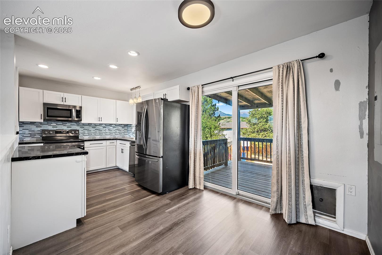 Dining area with sliding glass door to deck.