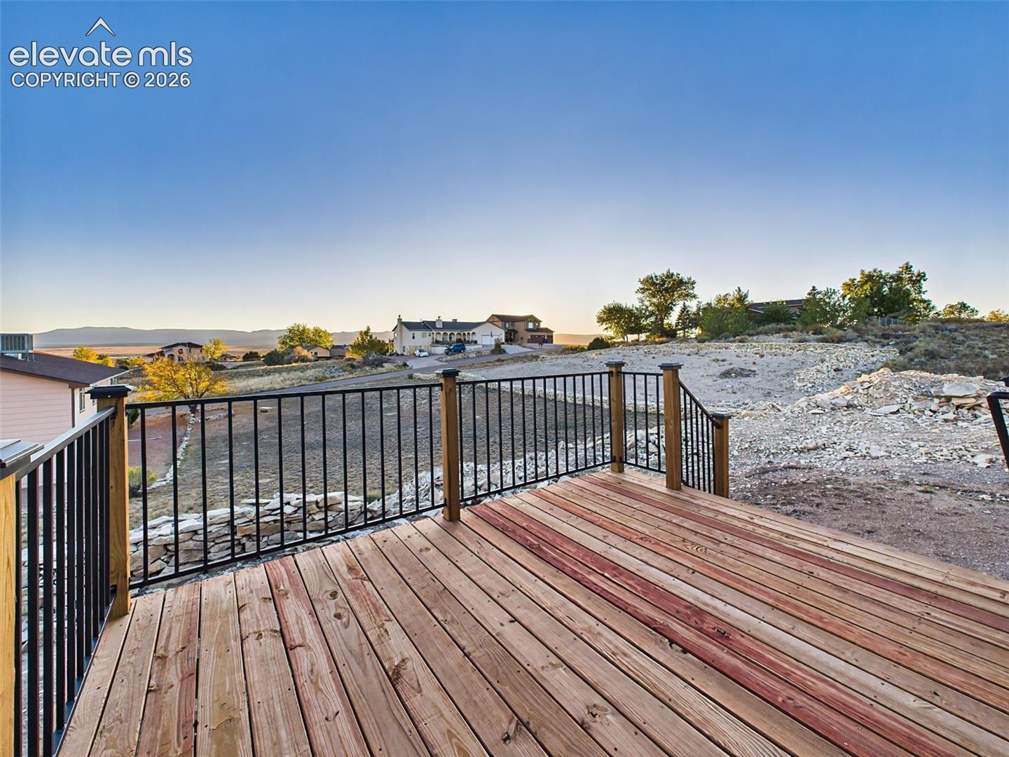 Wood deck with mountain backdrop—perfect for entertaining or relaxing outdoors.
