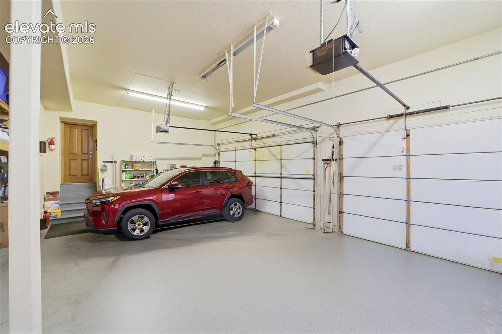 Attached Garage fits 3 Cars and is oversized with depth for garage freezers and storage