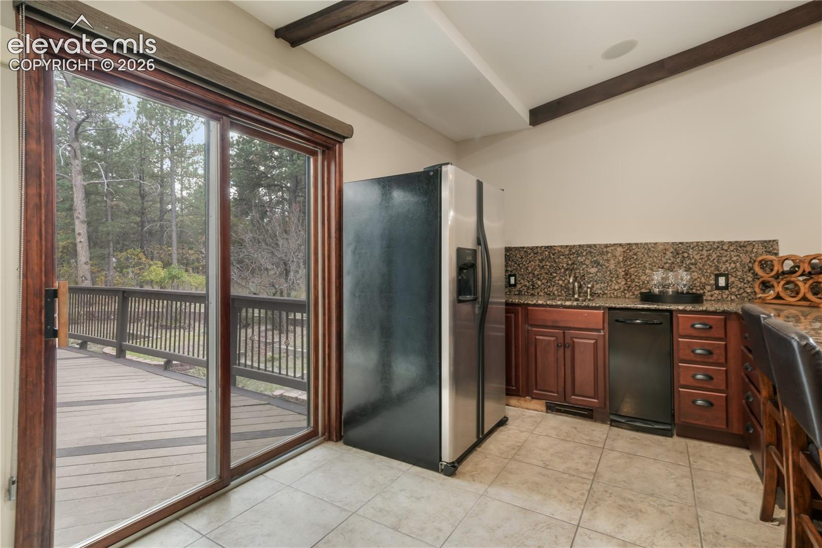 Large media/game room with wet bar and walk-out access