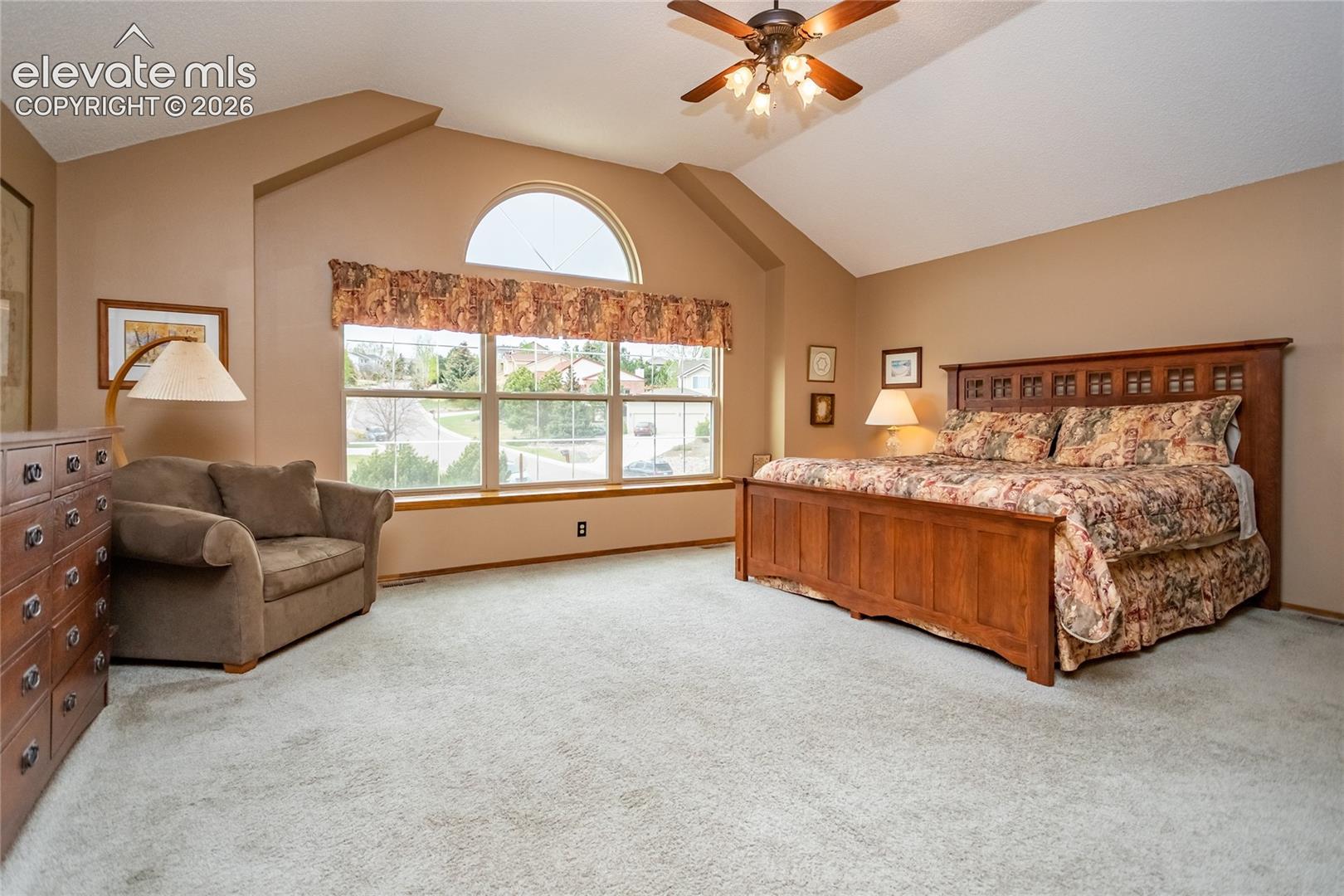 Huge Primary Bedroom w/ Vaulted Ceilings and plenty of Sitting/ Dressing Space