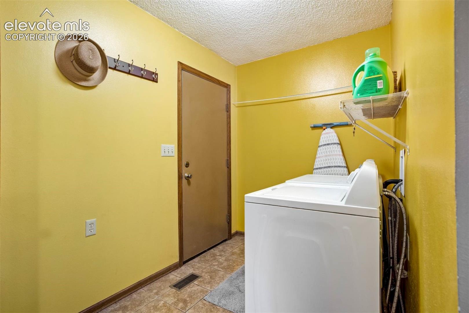 MAIN LEVEL Washer/Dryer included. Door to garage, half bath (not in pic), tiled floor