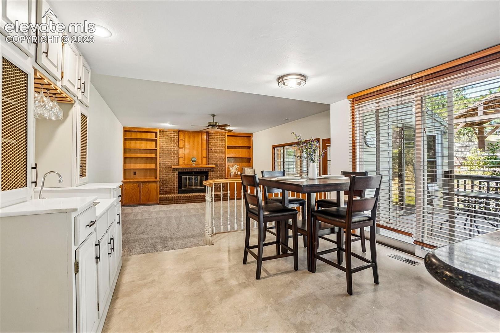 This less formal eating area has a walk-out to the back deck and there is a wet bar that makes for perfect entertaining indoors or out! 