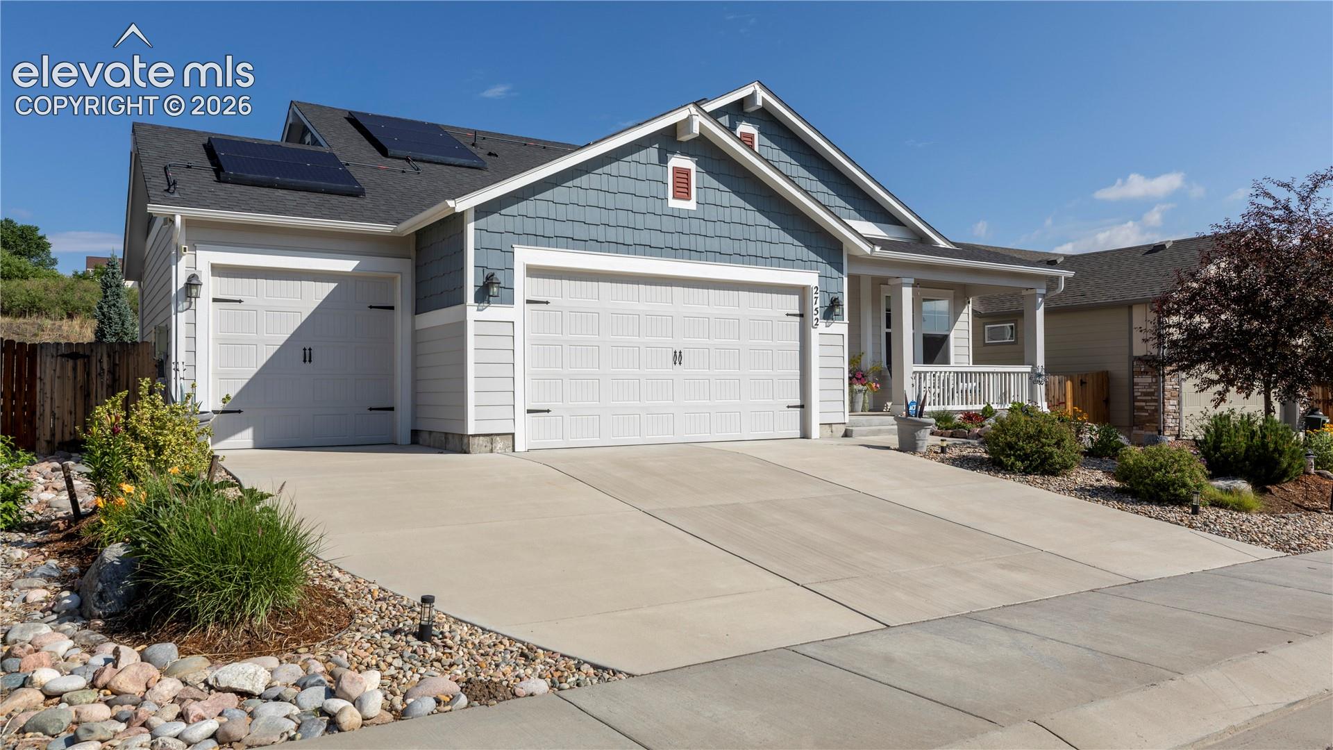 3 car garage with parking areas