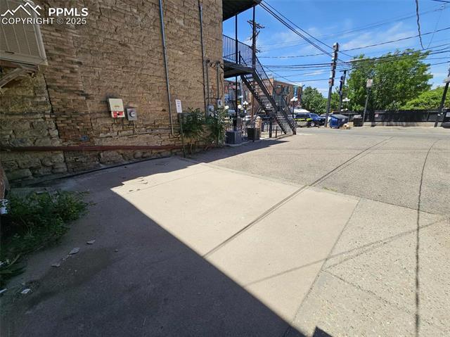 View of asphalt road featuring stairway