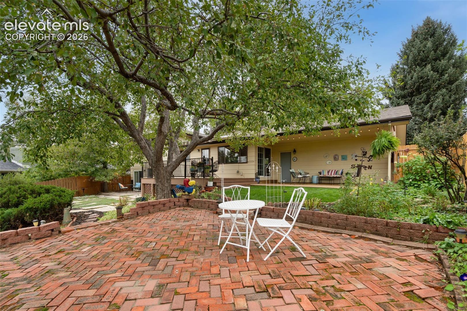 Brick patio provides additional space for outside entertaining.