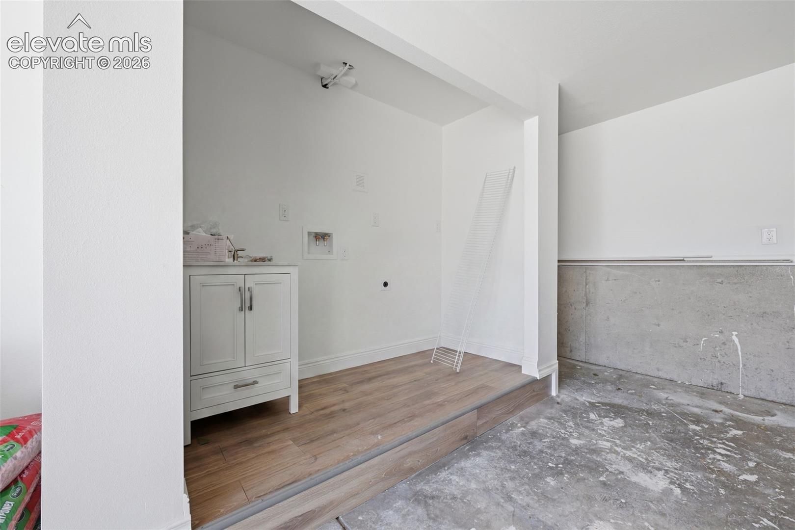 Secondary Laundry in Garage with sink 