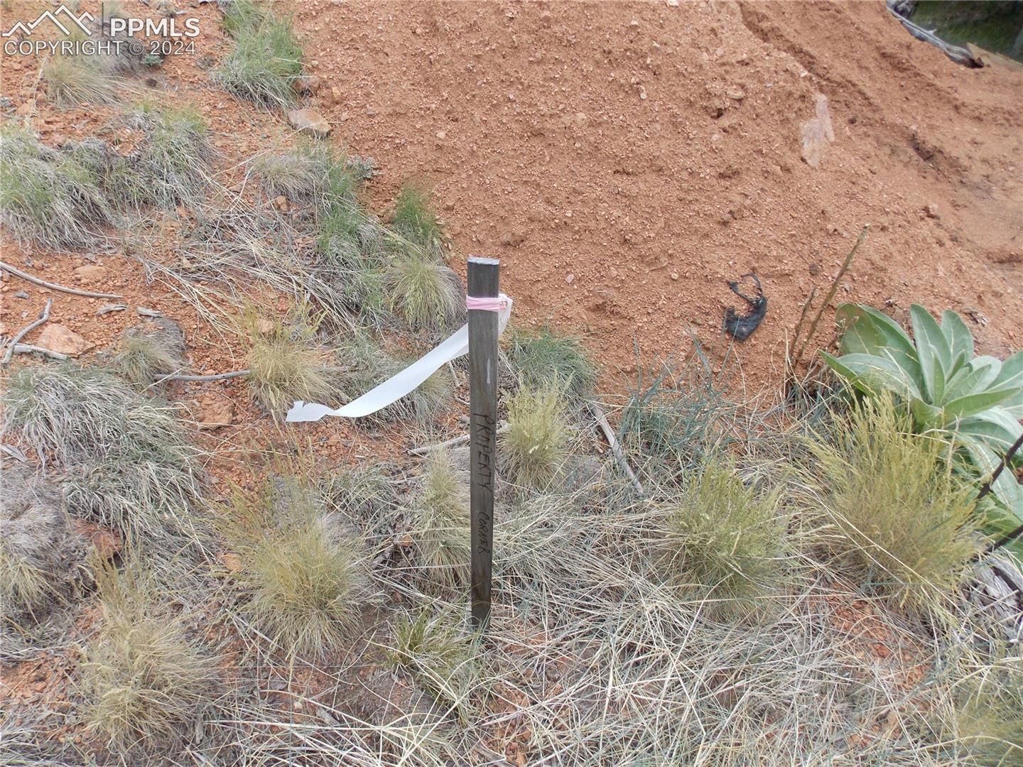 Marker located just up from the SouthEast Corner pin