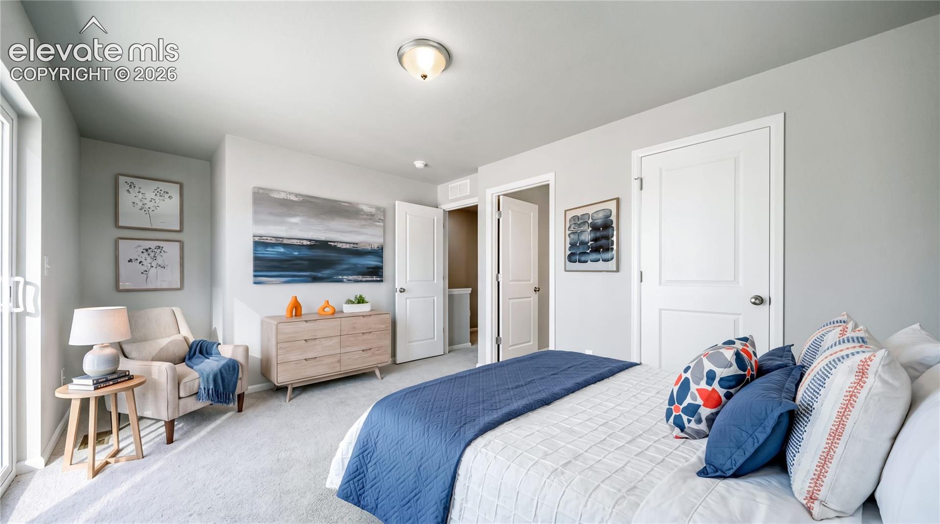 Neutral-toned interior featuring wall-to-wall carpeting, two-panel interior doors, and a sliding glass door
*photos of a model home*
