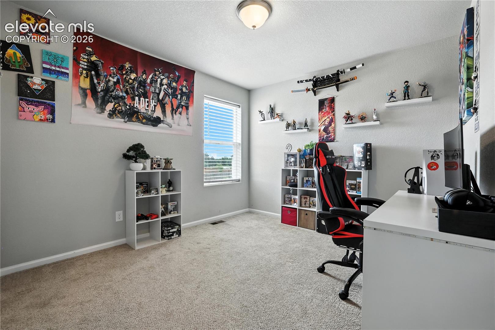Recessed ceiling light fixture, neutral wall color, and carpeted flooring