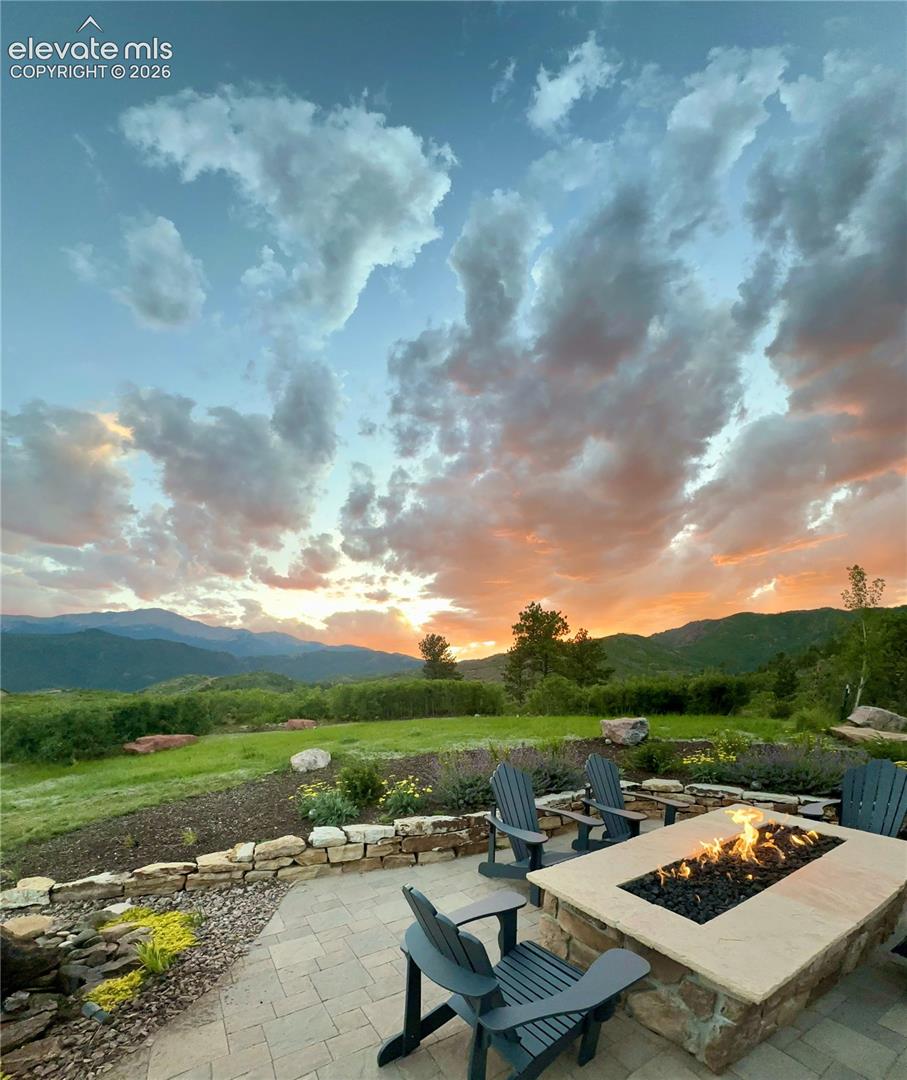 Golden hour at the fire pit, with Pikes Peak as your backdrop.