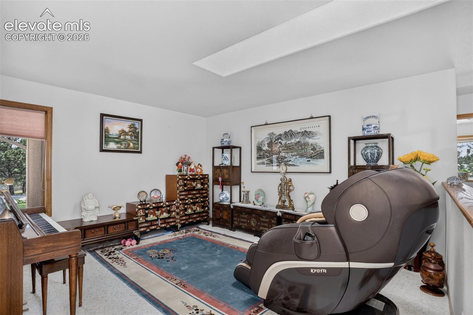 Formal living room with skylights.