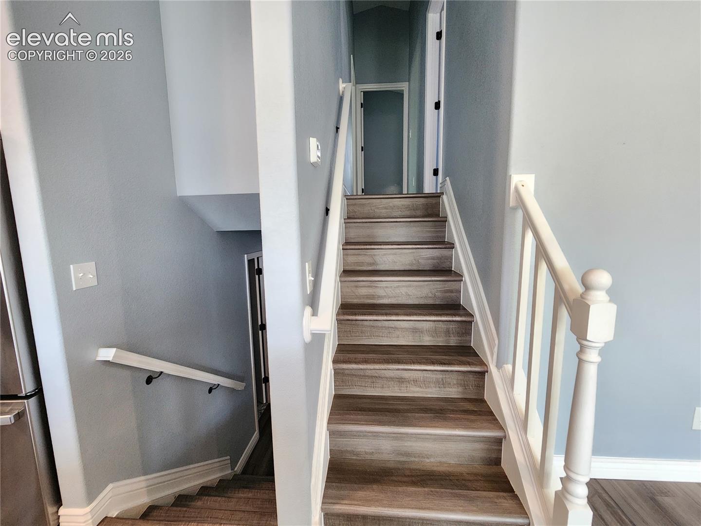 Inviting staircase leading to the home's multi-level living areas