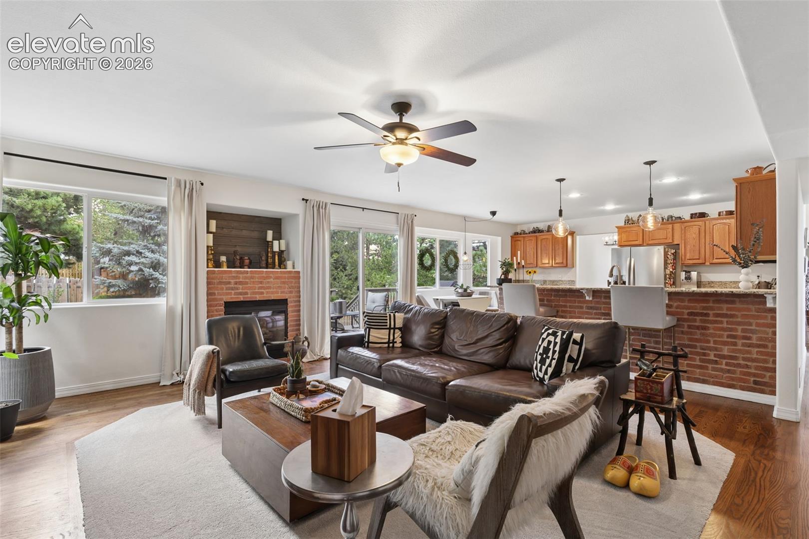 Family room, gas fireplace and adjacent kitchen
